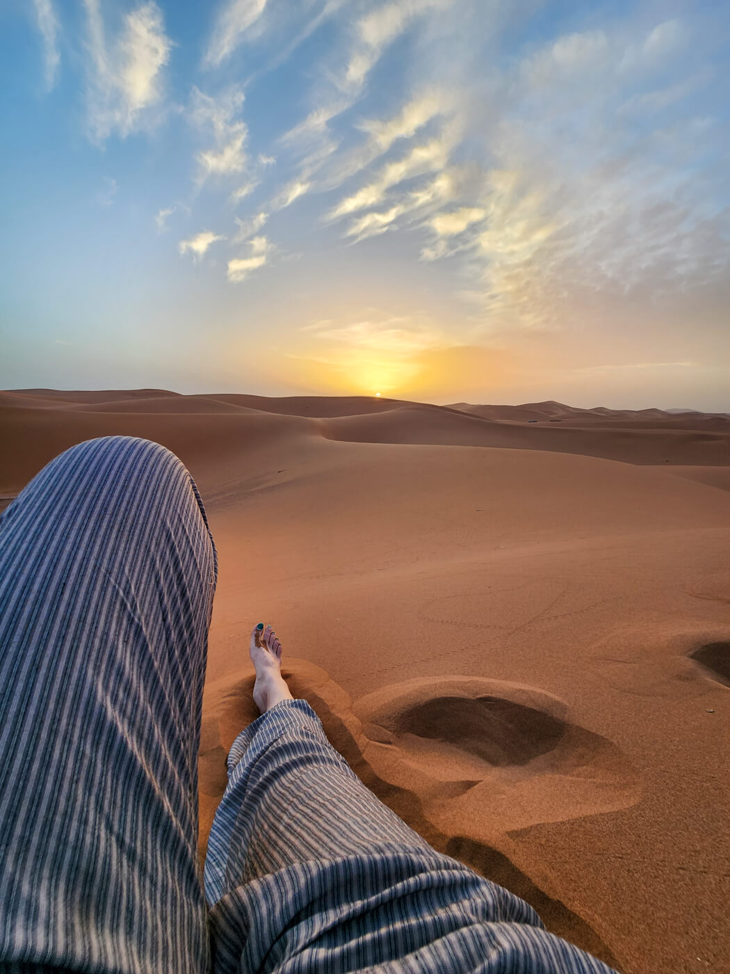 Featured image for “Laying back at sunset in Chegaga Dunes”