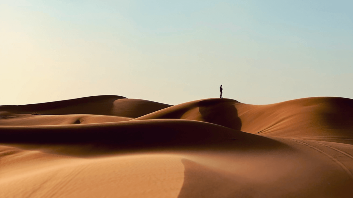 Man in the dunes of Erg Chebbi in Merzouga, Morocco