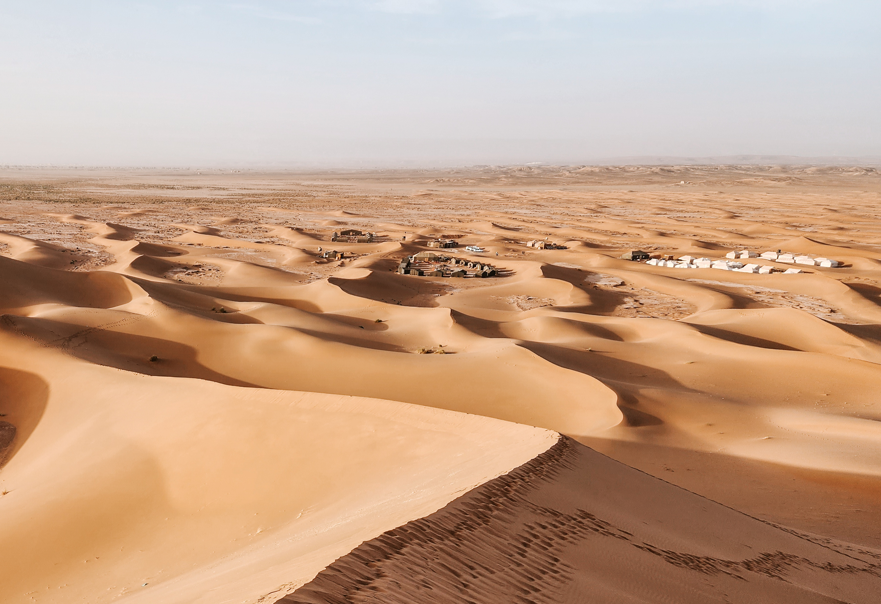 Camps nestled in the dunes of Erg Chegaga in the Sahara Desert of Morocco